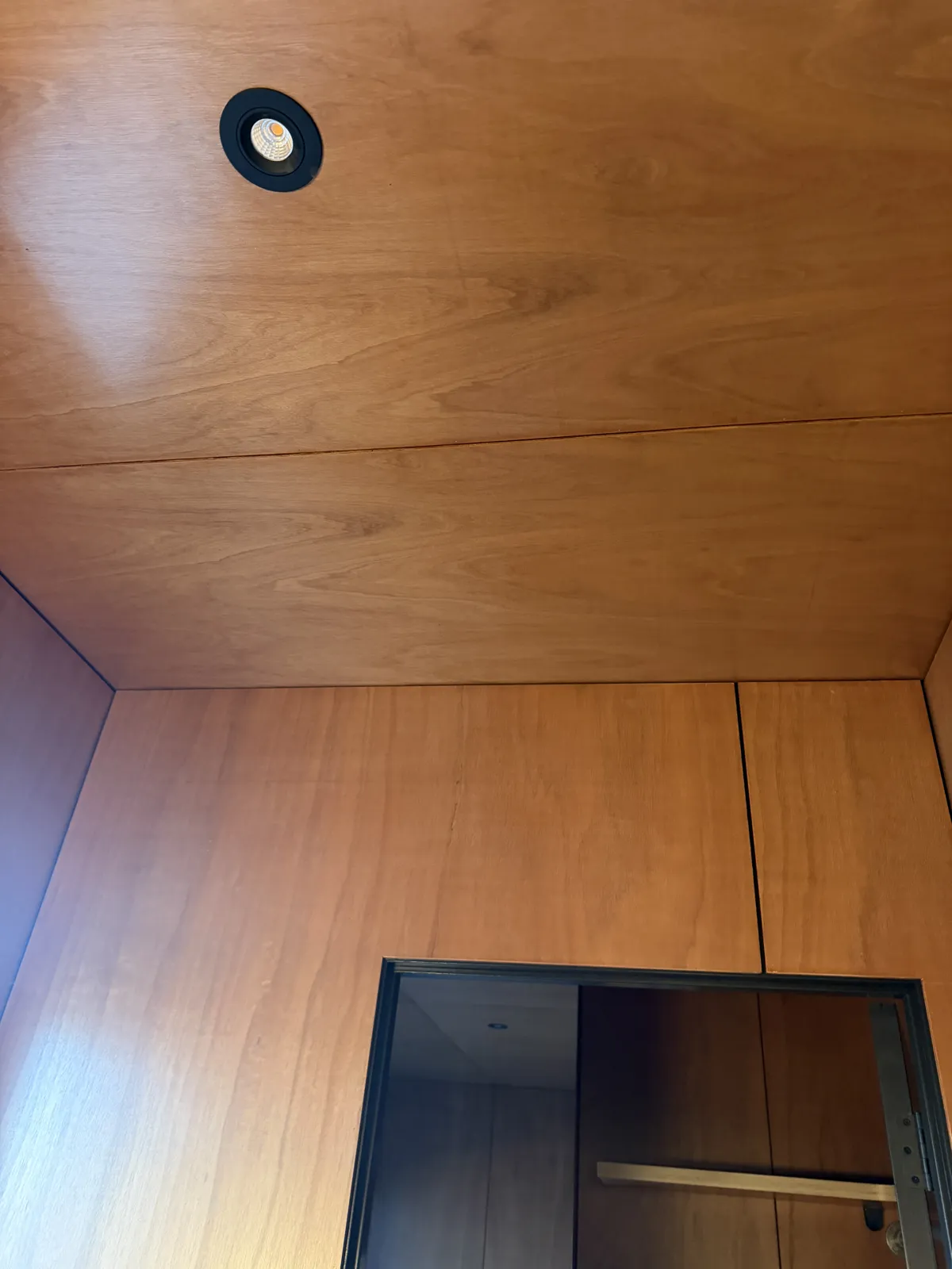 The first bathroom finished, timber ceiling recoated and the warmth back in the grain