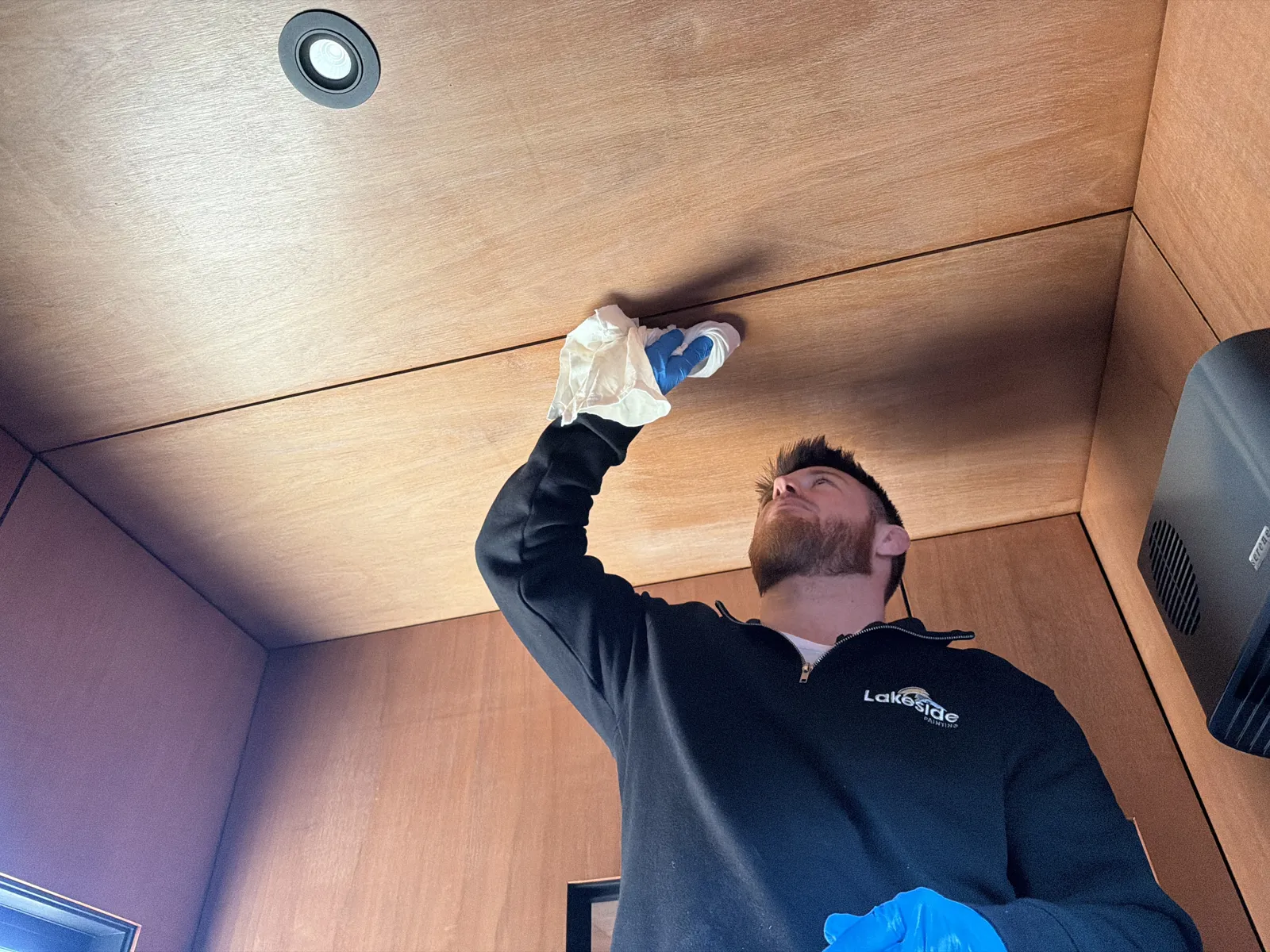 Rubbing the ceiling with a turps-dampened rag to check for an oil-based finish